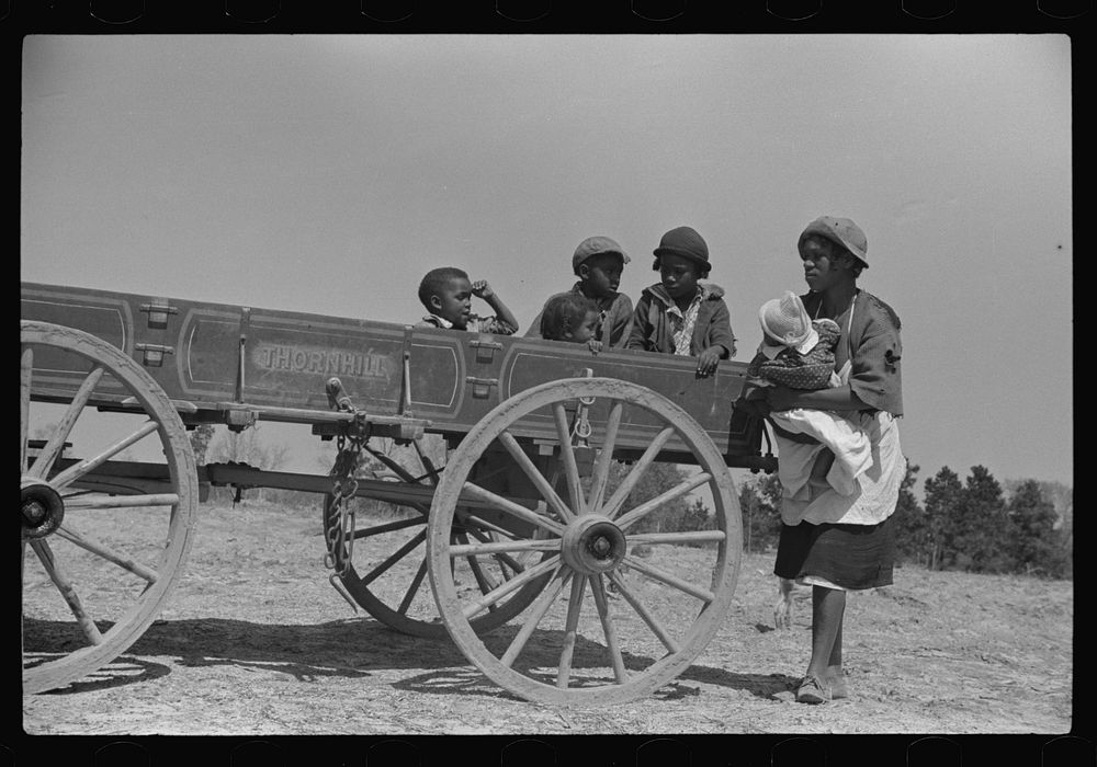 [Untitled photo, possibly related to: Charlie McGuire's family (tenant purchase clients) and their new wagon, Pike County…