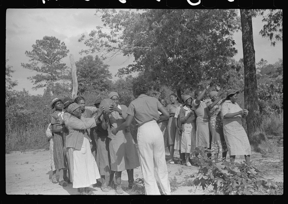 [Untitled photo, possibly related to: Juanita Coleman helps during recreation time for adult class. In the church she…