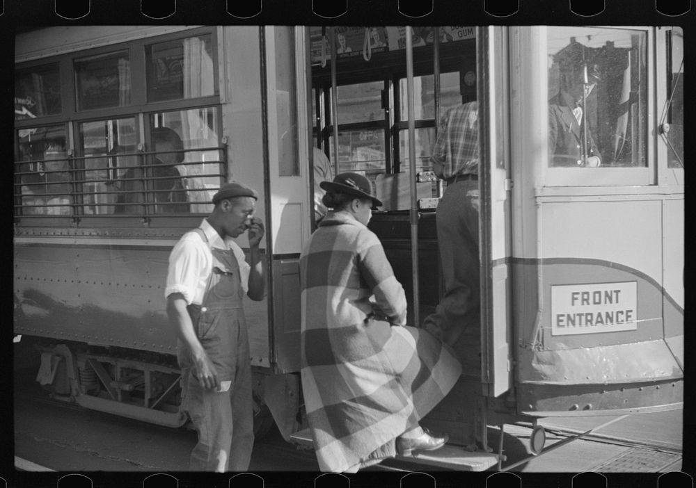 [Untitled photo, possibly related to: Domestic servants waiting for street car on way to work early in the morning. Mitchell…
