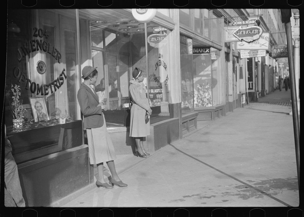 Domestic servants waiting for streetcar on way to work early in the morning. Mitchell Street, Atlanta, Georgia. Sourced from…