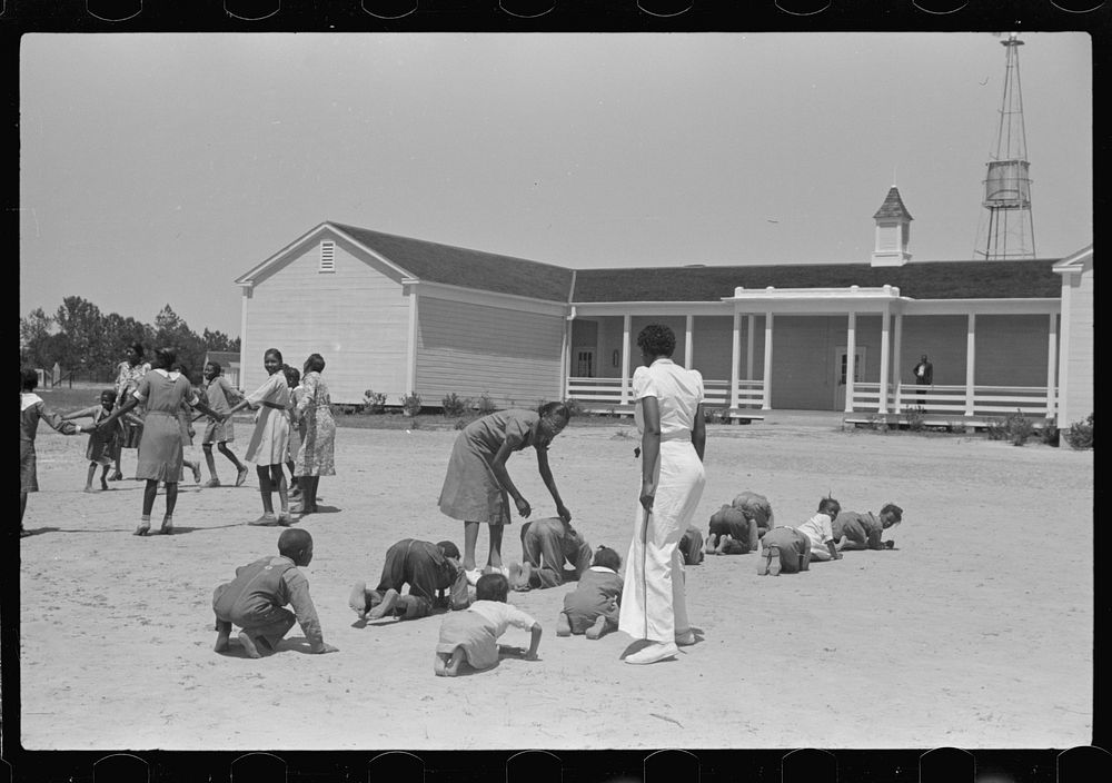 Florence Wright, recreation supervisor, starts off a game during outdoor class with schoolchildren, Gees Bend, Alabama.…