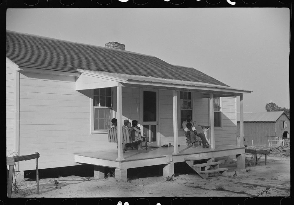 Nolan Pettway and some of his family on their front porch, Gees Bend, Alabama. Sourced from the Library of Congress.