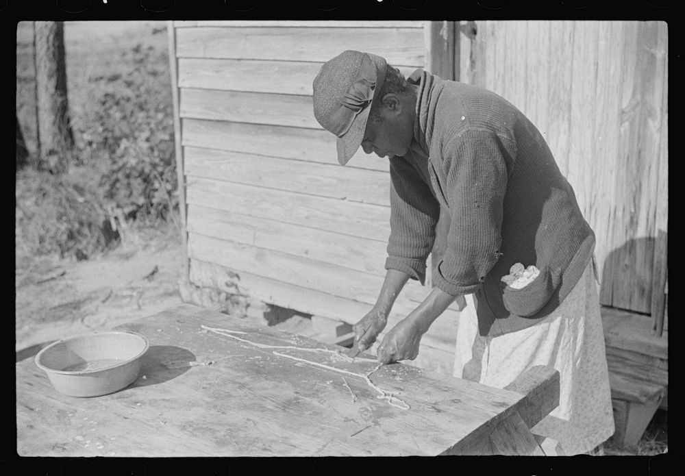 [Untitled photo, possibly related to:  woman making "chitlins" after hog-killing. Near Maxton, North Carolina]. Sourced from…