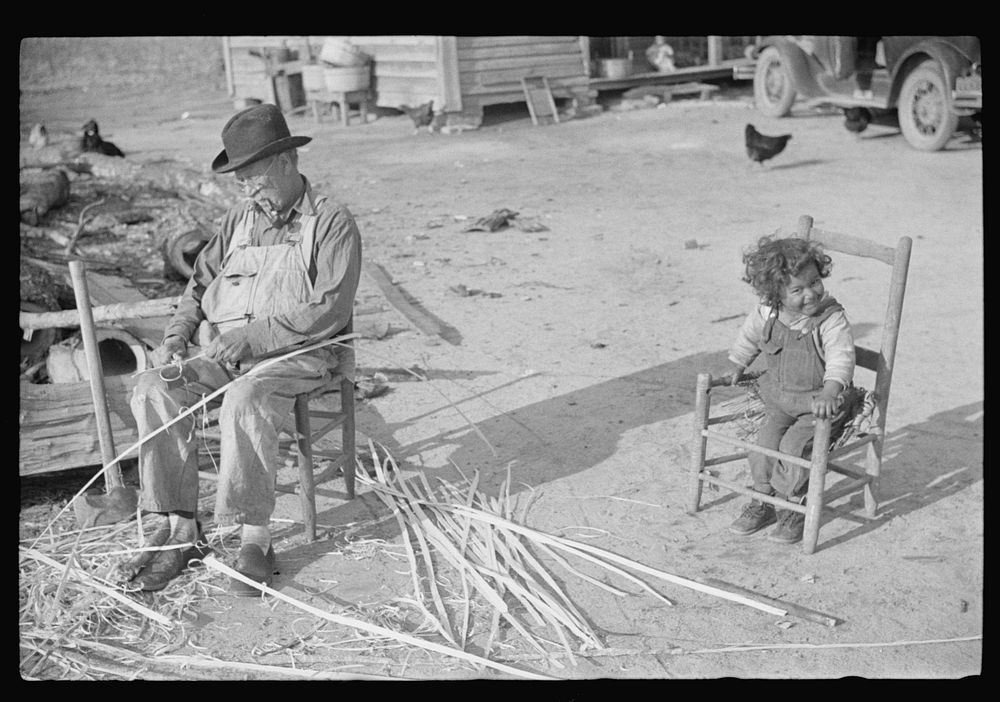 Mixed-breed Indian, white and , near Pembroke Farms, making new chair seat. North Carolina. Sourced from the Library of…