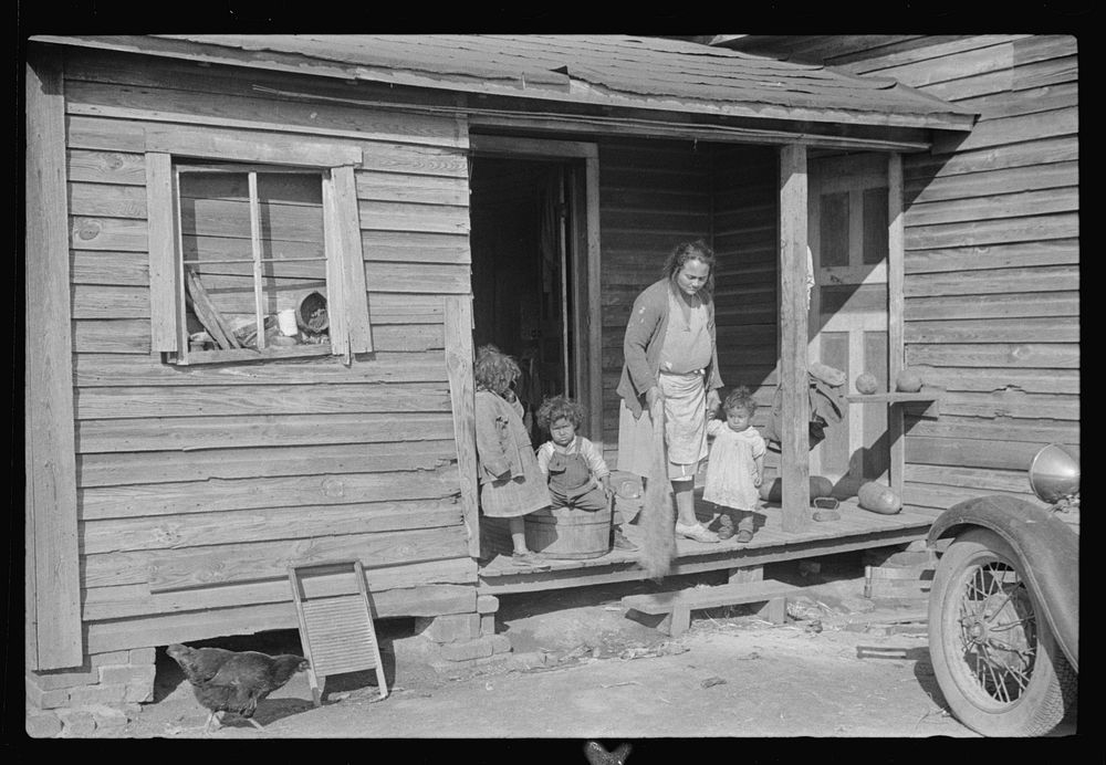 Mixed-breed Indian family, white and , in old house near Pembroke Farms, North Carolina. Sourced from the Library of…