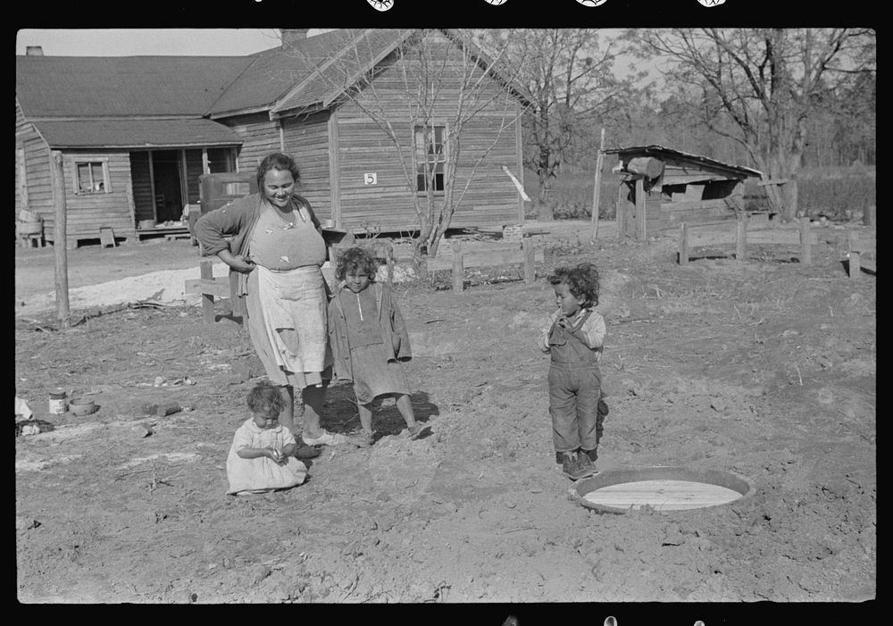 Mixed-breed Indian family, white and , looking at location for new farmhouse near Pembroke Farms, North Carolina. Sourced…