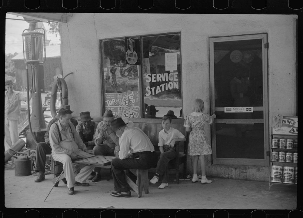 [Untitled photo, possibly related to: Playing cards outside service station, Saturday afternoon, Greensboro, Greene County…