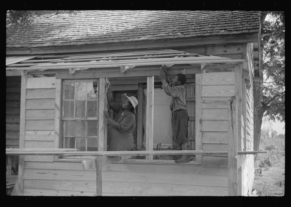 Pauline Clyburn, rehabilitation borrower, Manning, Clarendon County, South Carolina, and her son repairing home. Sourced…
