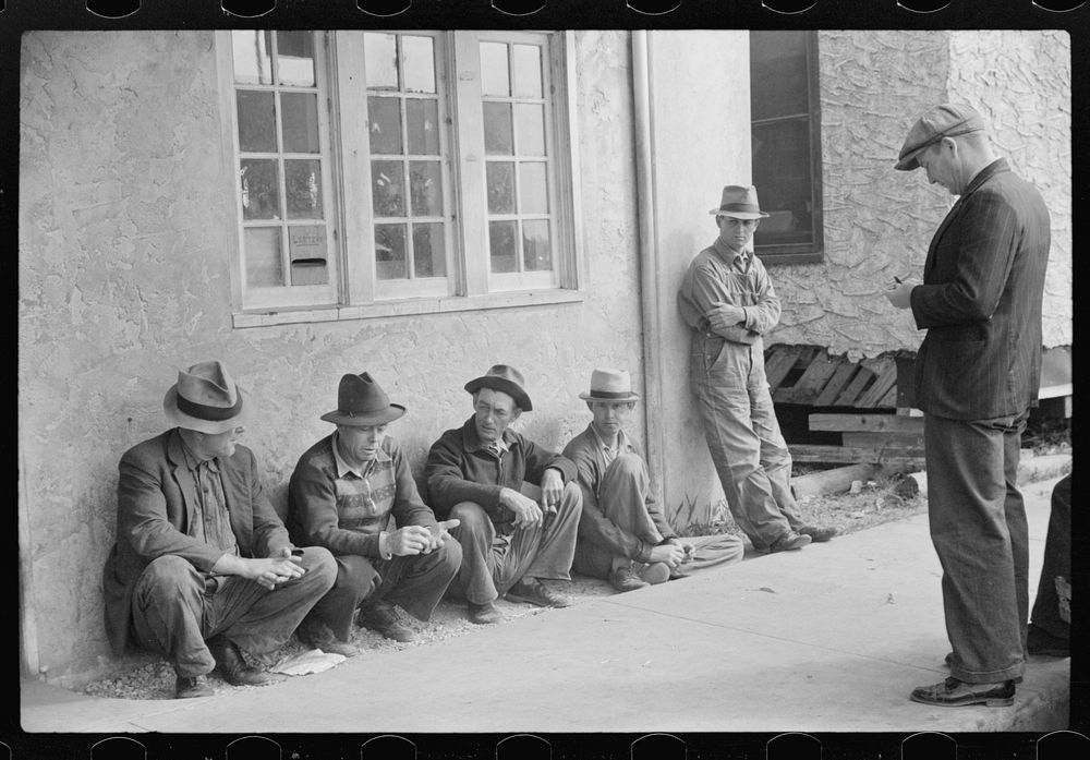 Migratory packinghouse workers waiting around post office during slack season. Belle Grande, Florida. Sourced from the…