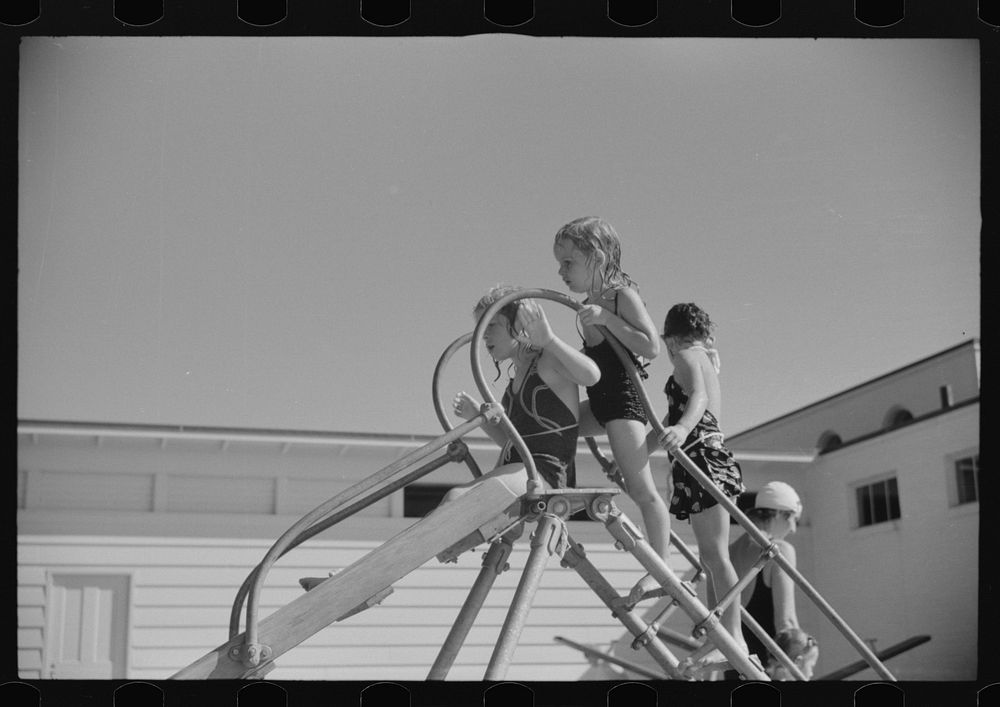 [Untitled photo, possibly related to: Sliding into the pool at Greenbelt, Maryland]. Sourced from the Library of Congress.