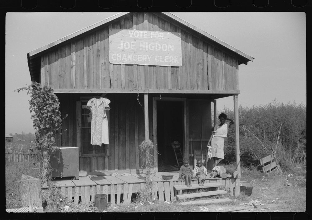 Political poster on sharecropper's house, Mississippi Delta, Mississippi. Sourced from the Library of Congress.