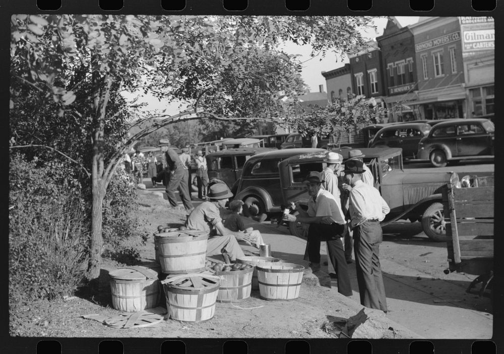 [Untitled photo, possibly related to: Selling apples on main street on Saturday afternoon, Lexington, Mississippi Delta…