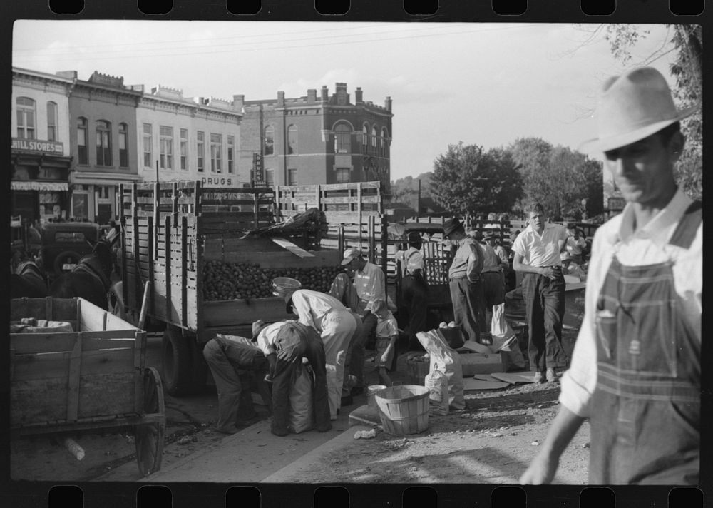 [Untitled photo, possibly related to: Selling apples on main street on Saturday afternoon, Lexington, Mississippi Delta…