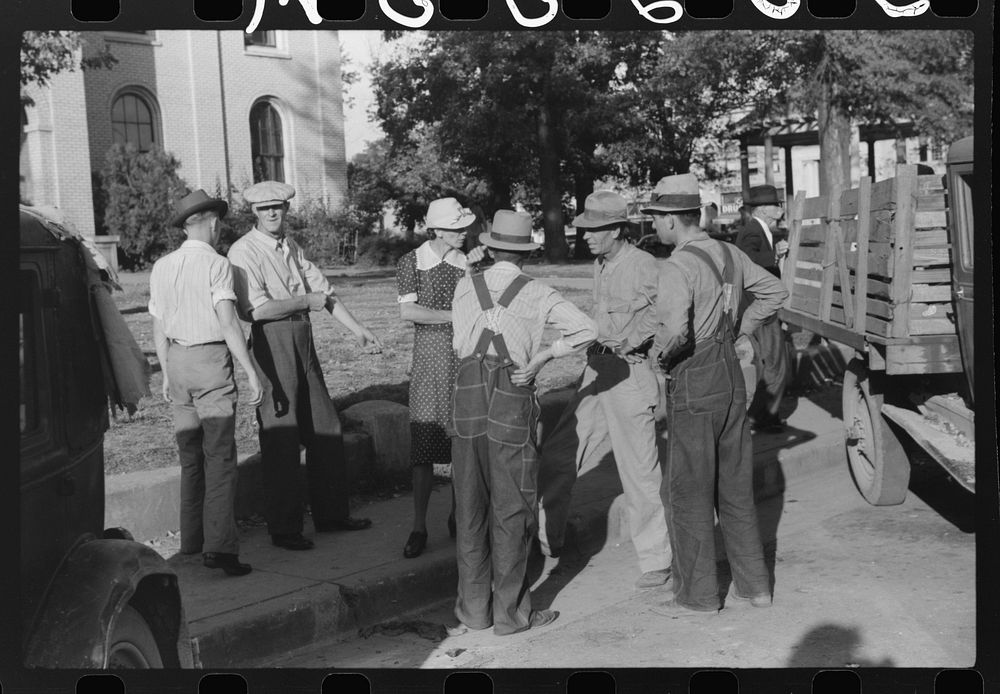 Visiting in front of courthouse on Saturday afternoon, Lexington, Mississippi Delta, Mississippi. Sourced from the Library…