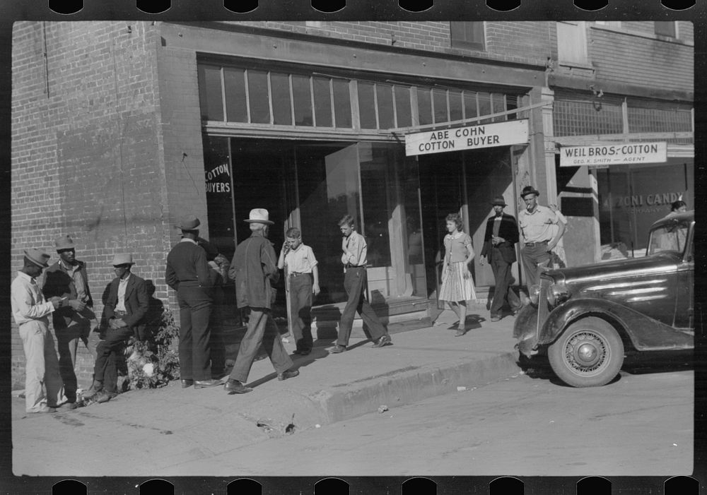Cotton offices, main street, Saturday afternoon, Belzoni, Mississippi Delta, Mississippi. Sourced from the Library of…