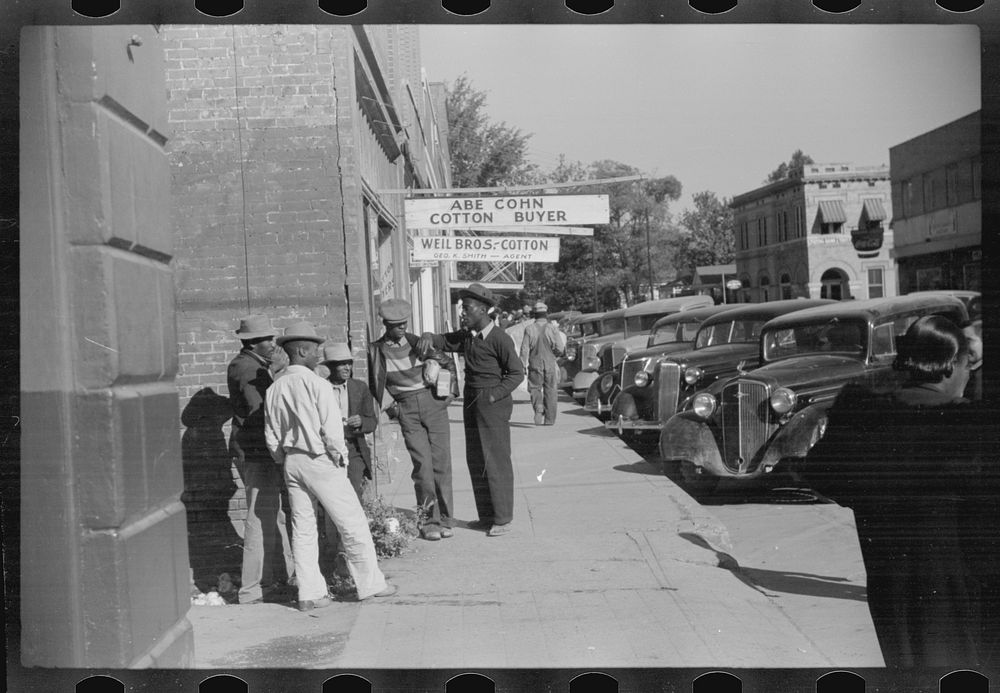 Cotton offices, main street, Saturday afternoon, Belzoni, Mississippi Delta, Mississippi. Sourced from the Library of…