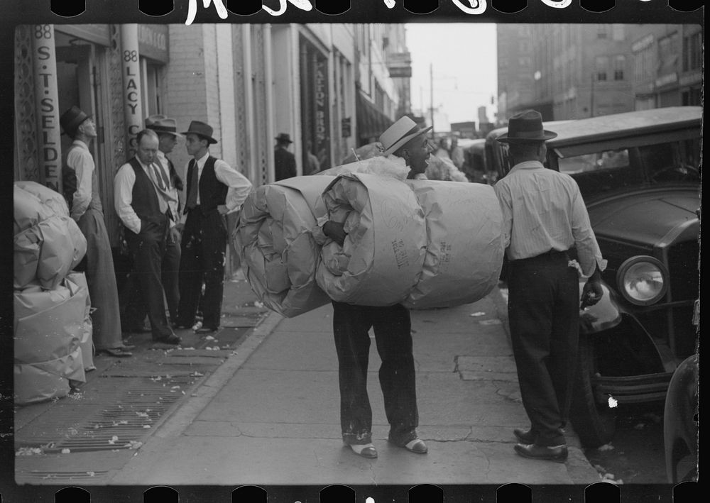 Cotton samples being taken to one of the broker's offices for sampling and classing rooms in brokers' offices on Cotton Row…