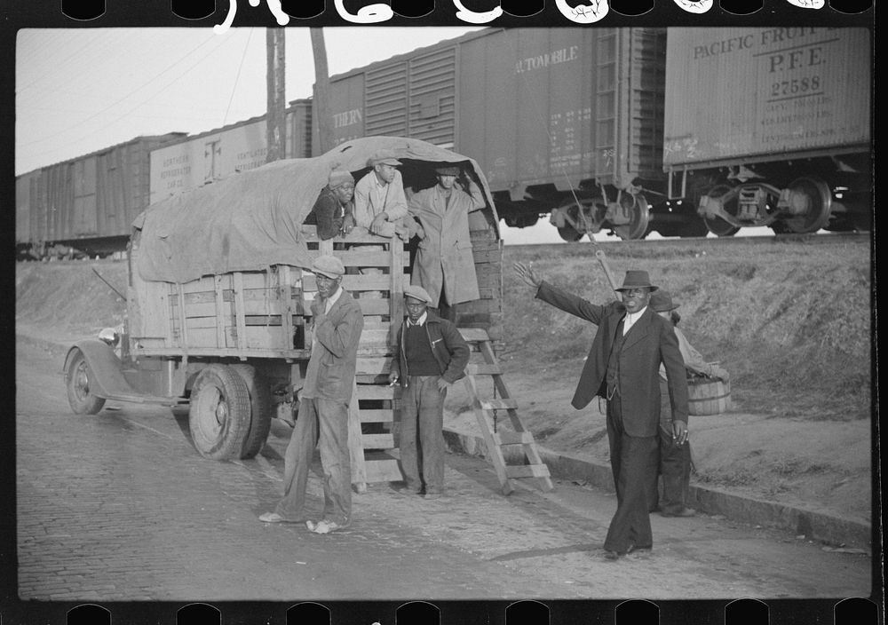 Day laborers being hired for cotton picking on Mississippi and Arkansas plantations. Between four and six-thirty every…