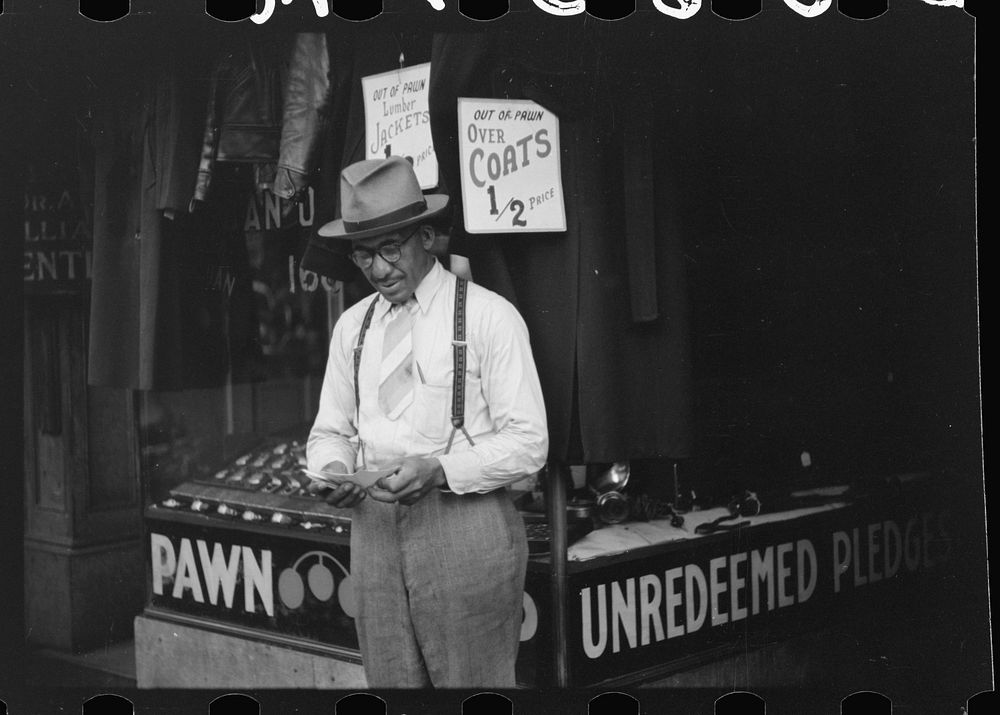 [Untitled photo, possibly related to: Pawn shop and secondhand clothing store on Beale Street, Memphis, Tennessee]. Sourced…