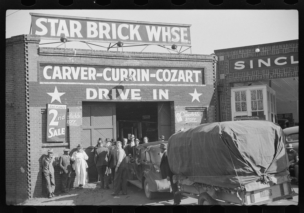 [Untitled photo, possibly related to: Tobacco on trailer being brought into star brick warehouse,for auction sale, Durham…