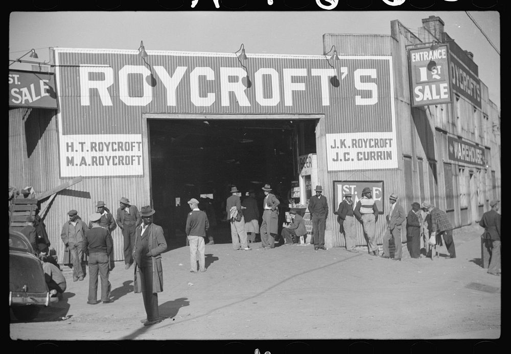 [Untitled photo, possibly related to: Entrance to tobacco warehouse during auction sales. Durham, North Carolina]. Sourced…