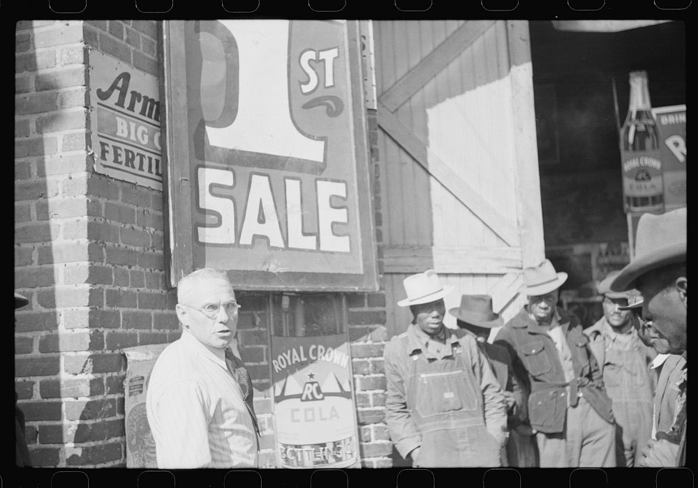 [Untitled photo, possibly related to: Farmer buying patent medicine from salesman outside tobacco warehouse during auction…