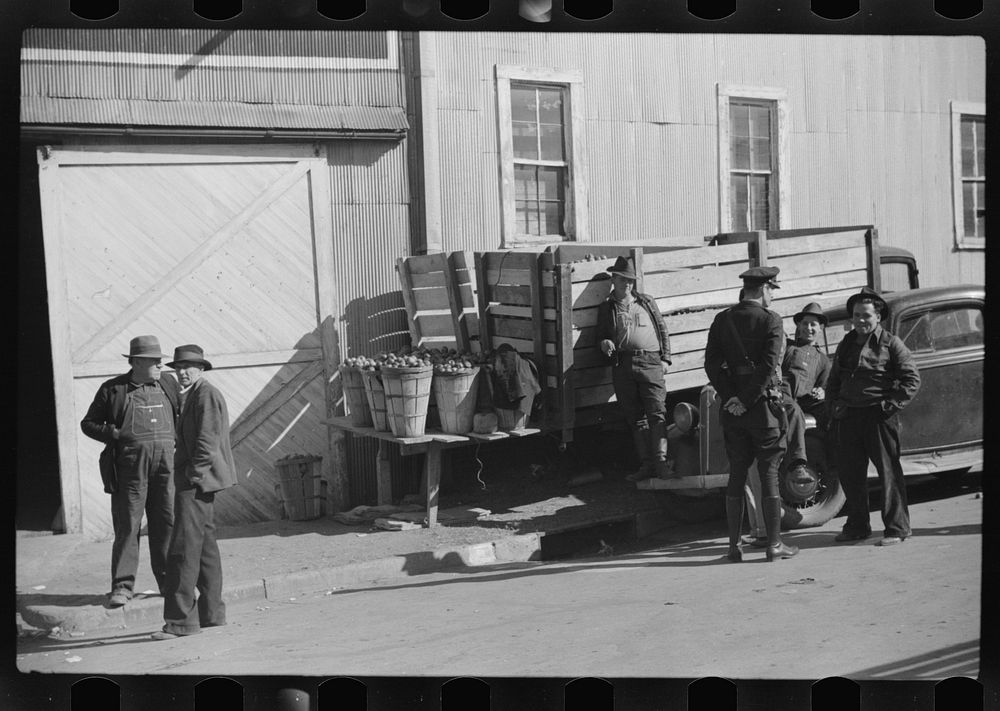 [Untitled photo, possibly related to: Outside tobacco warehouse after auction sale. Durham, North Carolina]. Sourced from…