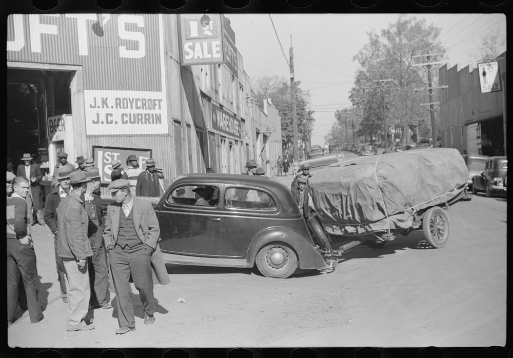 Taking tobacco into the warehouse for auction. Durham, North Carolina. Sourced from the Library of Congress.