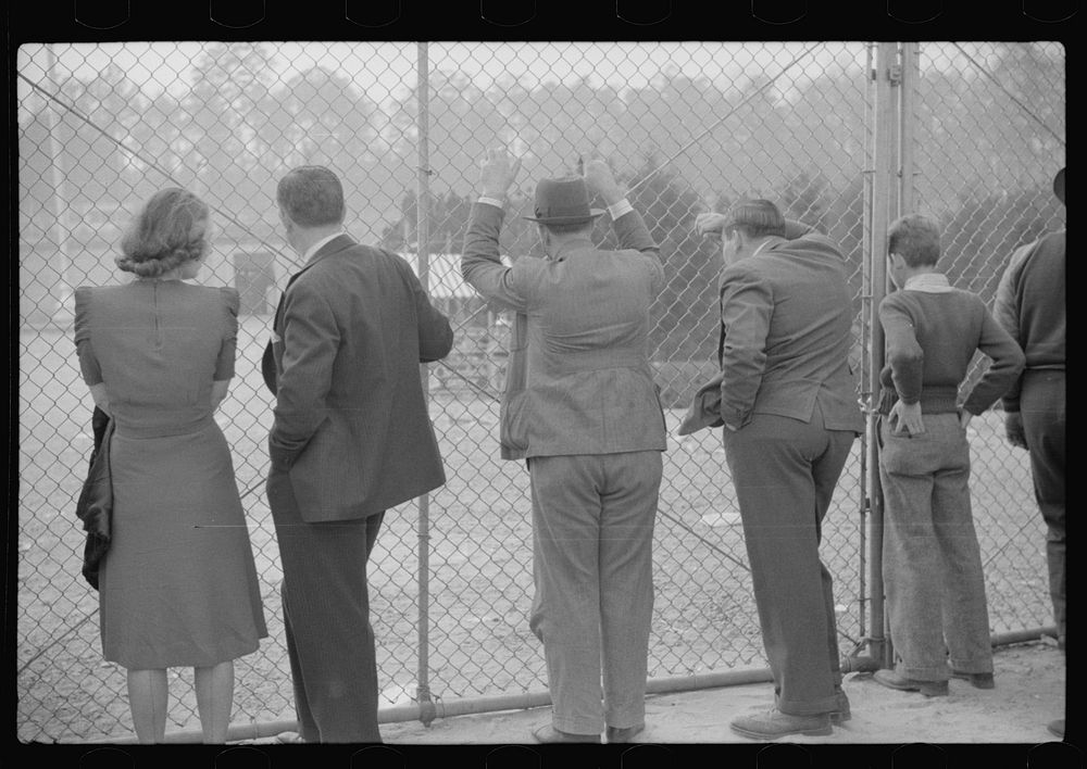 Spectators standing outside the gate of the Duke University Stadium because there were no more seating accomodations. Duke…