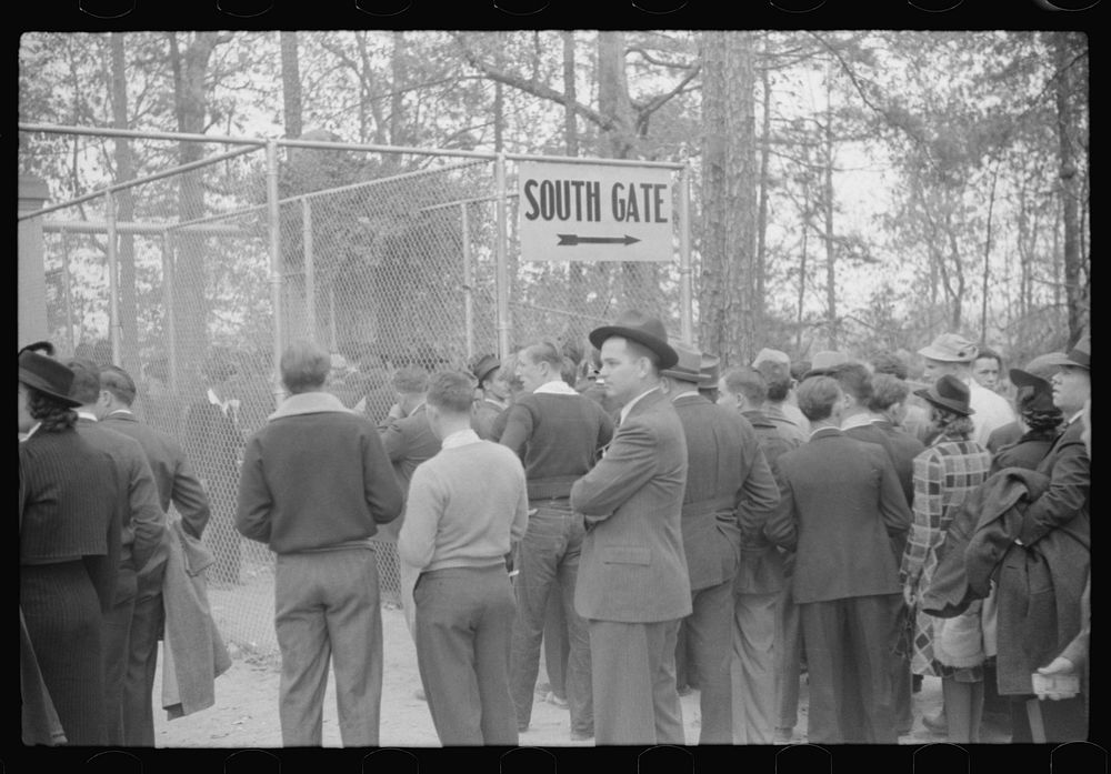 [Untitled photo, possibly related to: Spectators outside of the stadium at the Duke University-North Carolina football game.…