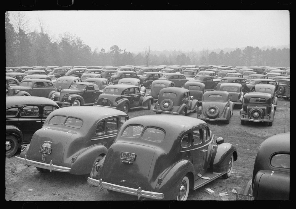Cars parked outside the stadium at the Duke University-North Carolina game. Durham, North Carolina by Marion Post Wolcott