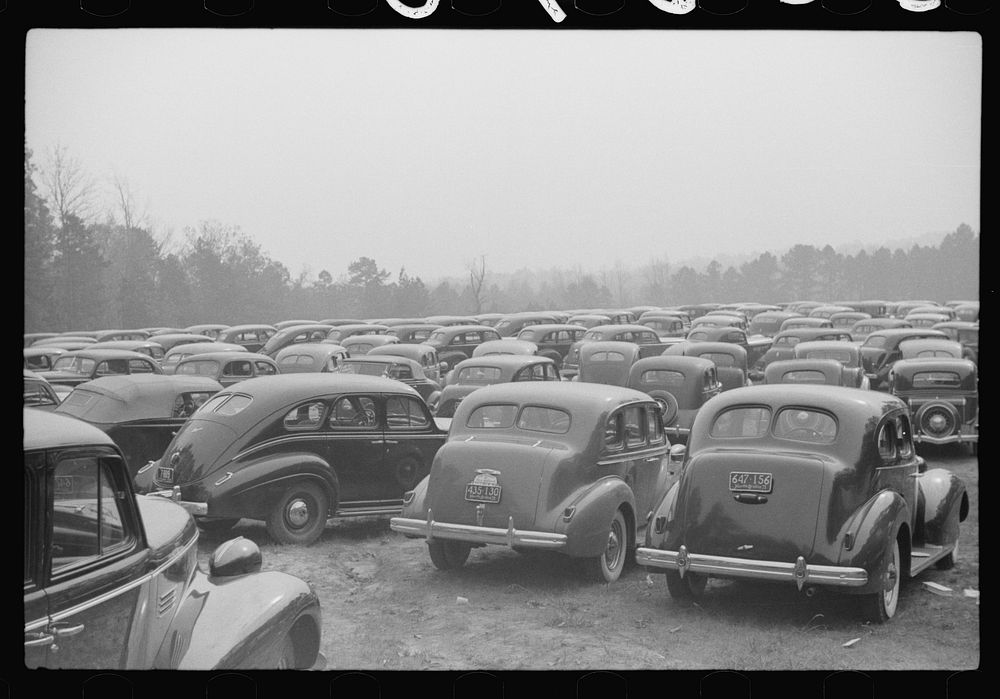 [Untitled photo, possibly related to: Cars parked outside the stadium at the Duke University-North Carolina game. Durham…