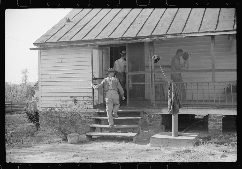 [Untitled photo, possibly related to: Men who were helping with corn shucking going into house to wash up before dinner.…
