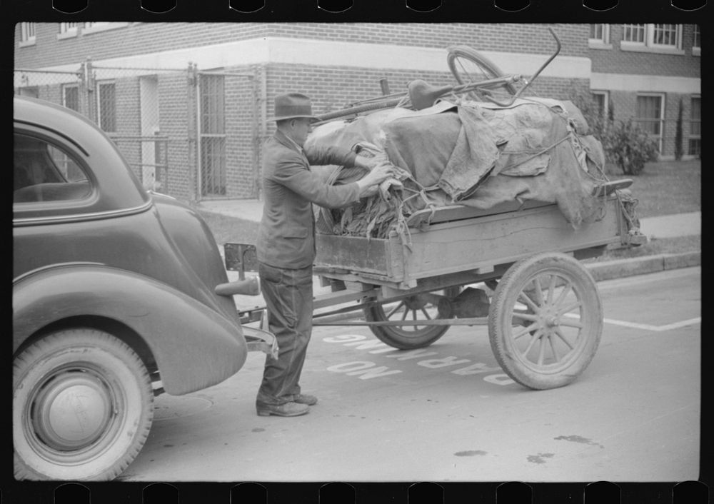 [Untitled photo, possibly related to: Mr. Wilkins with trailer full of tobacco which he has brought to be auctioned at…