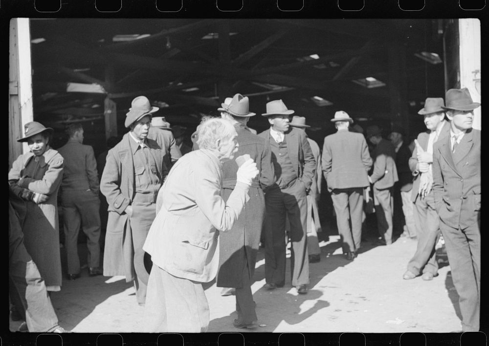 [Untitled photo, possibly related to: Itinerant preacher spreading "religion" to farmers outside warehouse while tobacco…