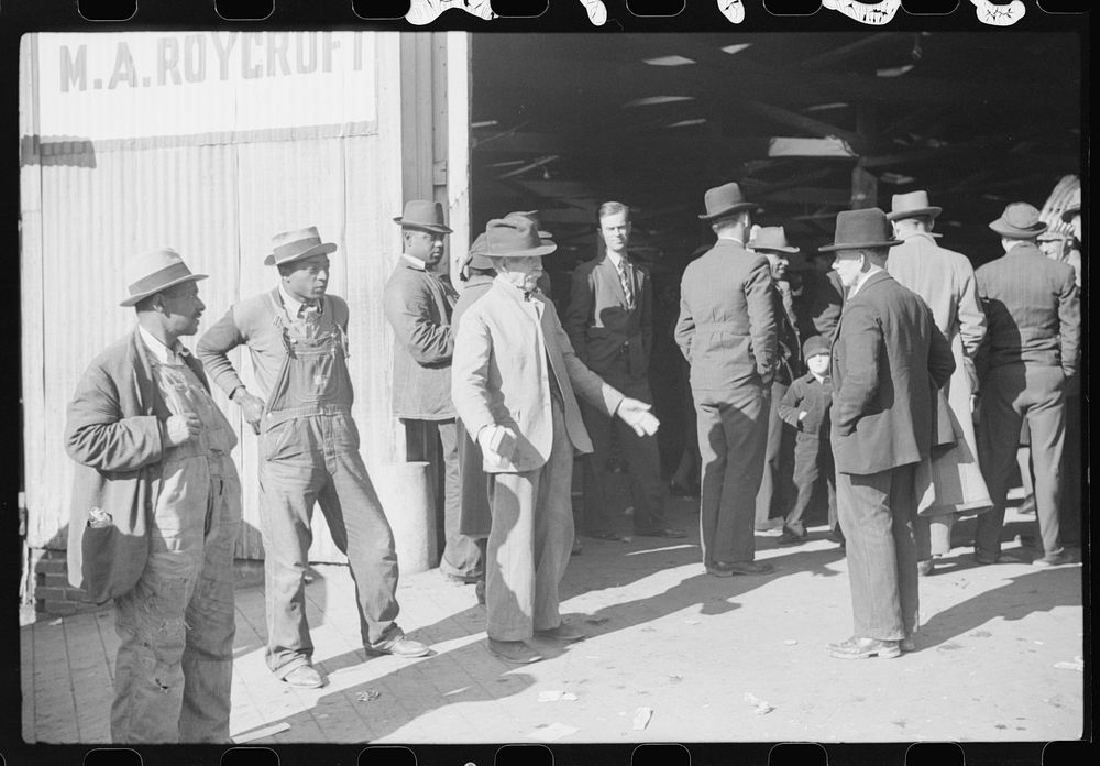 [Untitled photo, possibly related to: Itinerant preacher spreading "religion" to farmers outside warehouse while tobacco…