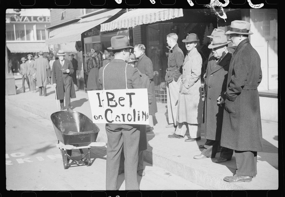 [Untitled photo, possibly related to: Tobacco auctioneer who "bet on Carolina" and lost, pays off the wager by pushing the…