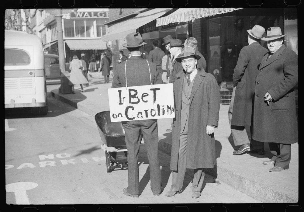 [Untitled photo, possibly related to: Tobacco auctioneer who "bet on Carolina" and lost, pays off the wager by pushing the…