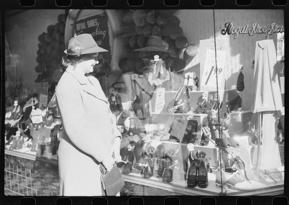 Mrs. Evan Wilkins (Rosa) looking in shop window. She came to Durham this day with her husband to sell their tobacco at…