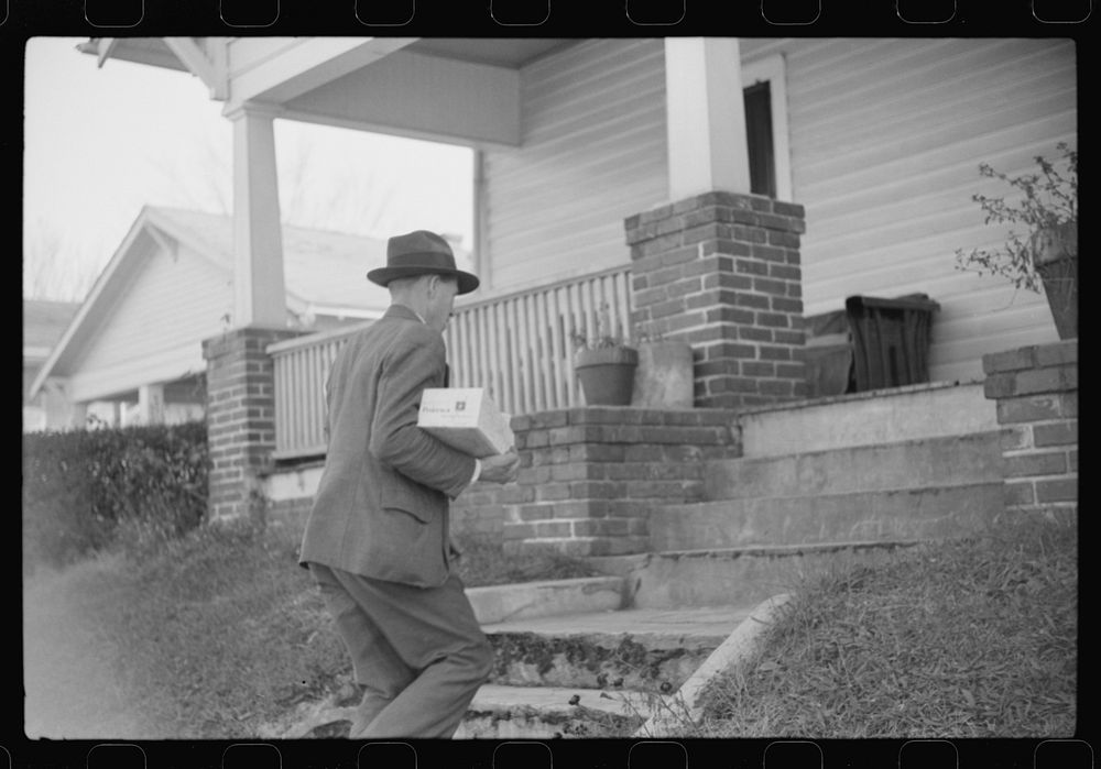 Mr. Evan Wilkins with butter he is selling which was made on his farm, Durham, North Carolina. Sourced from the Library of…