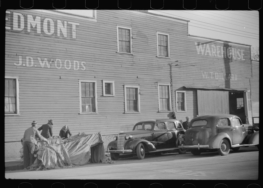 [Untitled photo, possibly related to: Cars belonging to farmers loaded with tobacco which is being brought to warehouse for…