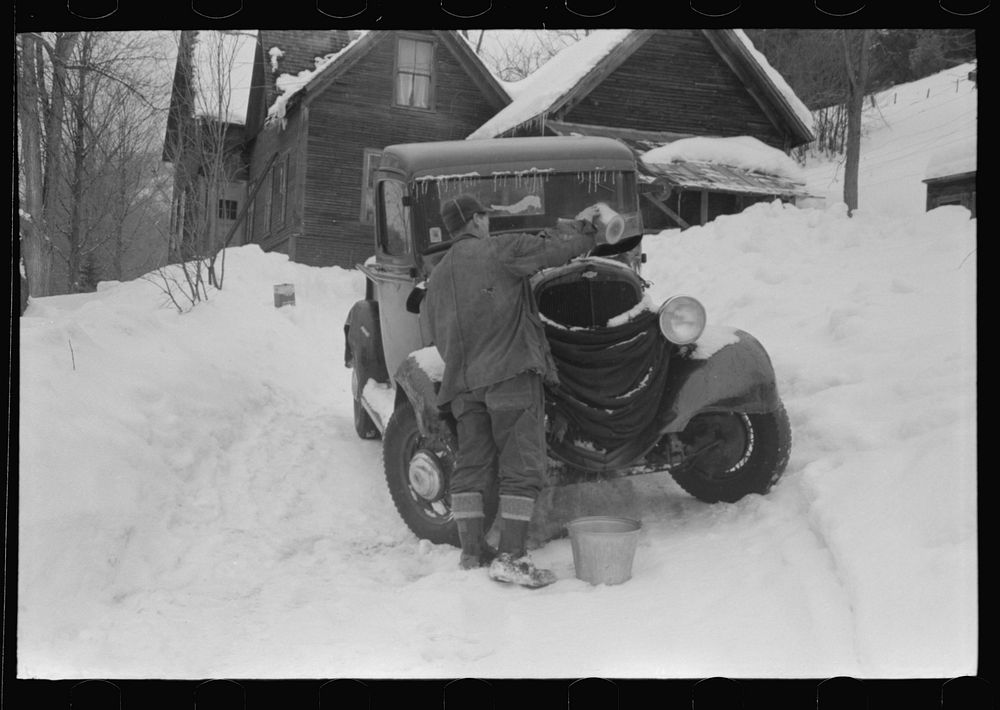 [Untitled photo, possibly related to: Hired man on farm near Woodstock, Vermont, usually empties the radiator in his car…