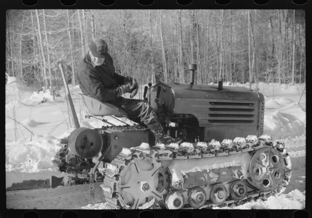 Hauling timber by tractor to the road where it is taken by truck to the mill. Near Barnard, Windsor County, Vermont. Sourced…
