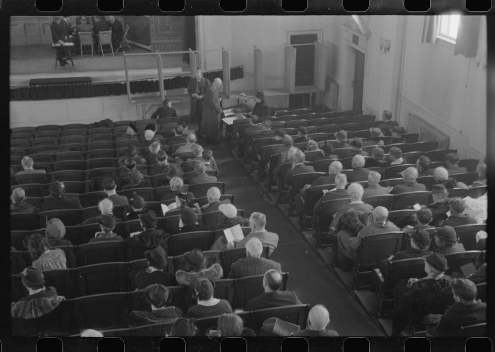 Townspeople listening to discussion and balloting during town meeting.  Woodstock, Vermont. Sourced from the Library of…