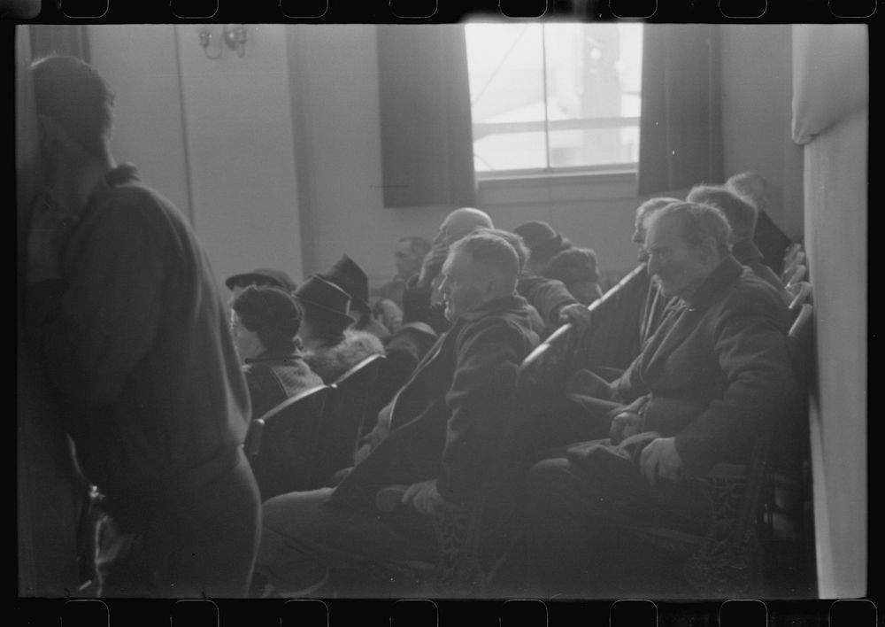 [Untitled photo, possibly related to: Townspeople listening to discussion during town meeting, Woodstock, Vermont]. Sourced…