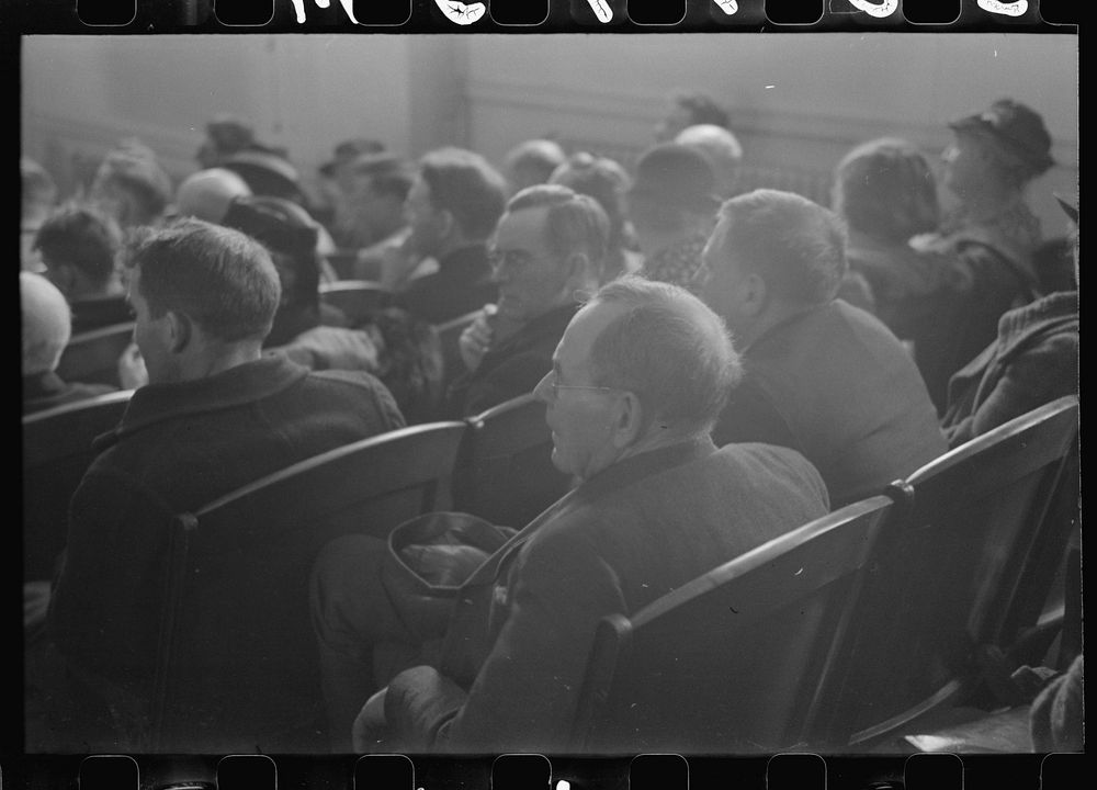 [Untitled photo, possibly related to: Townspeople listening to discussion during town meeting, Woodstock, Vermont]. Sourced…