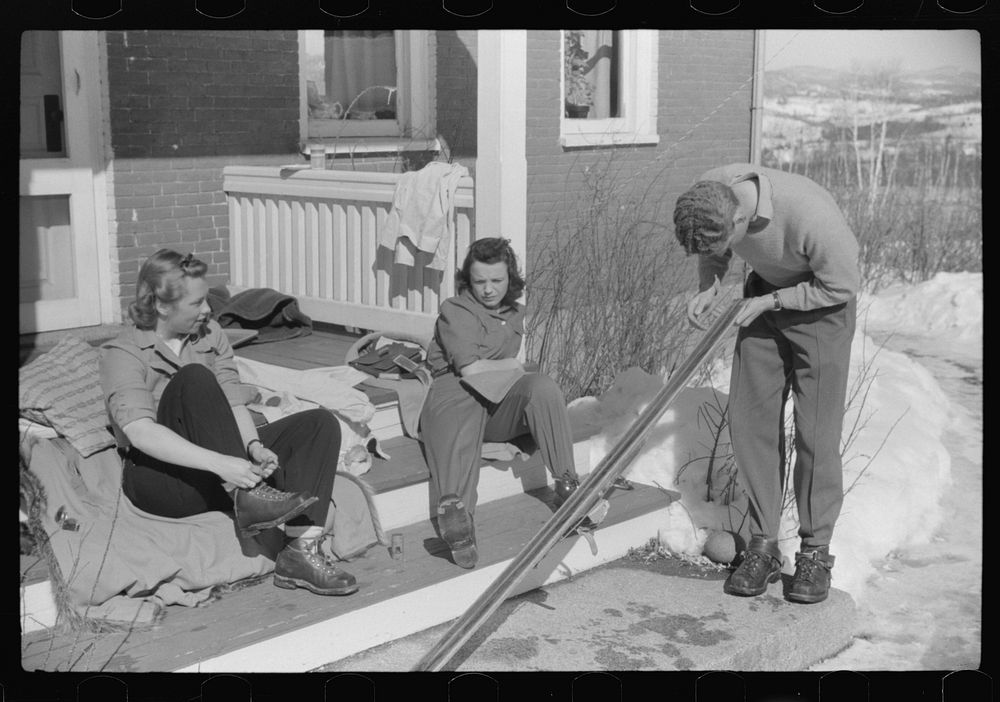 Skiers on porch of Mr. Dickinson's home in Lisbon, Franconia, New Hampshire. He installed a ski tow on his property three…