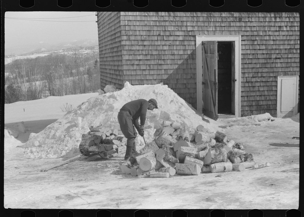 Hired hand on Mr. Dickinson's farm, splitting logs for winter fuel. Lisbon, near Franconia, New Hampshire. Sourced from the…