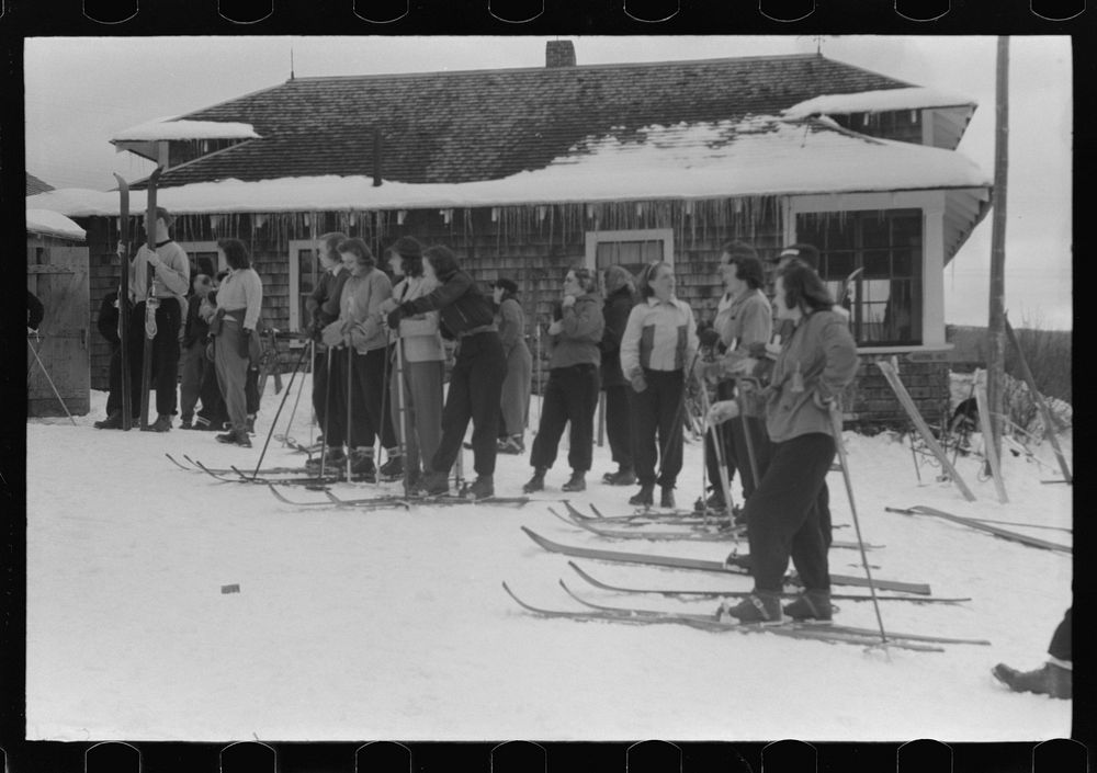 [Untitled photo, possibly related to: Skiers during noon hour outside of toll house at foot of Mount Mansfield, Smugglers…