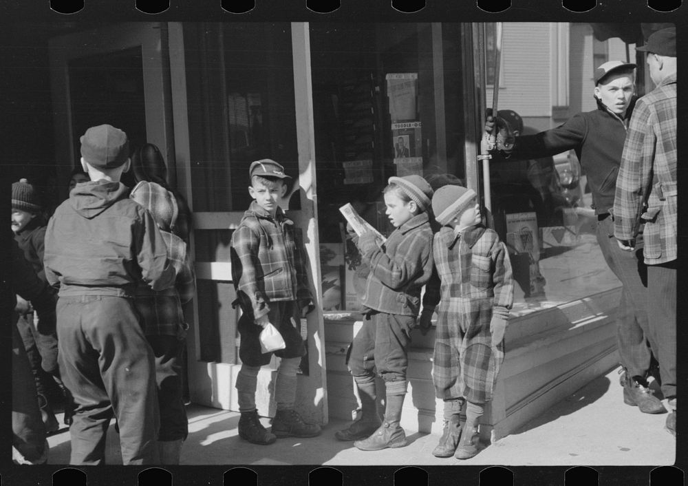 [Untitled photo, possibly related to: Children and farmers waiting to go into movie on Saturday afternoon, Littleton, New…